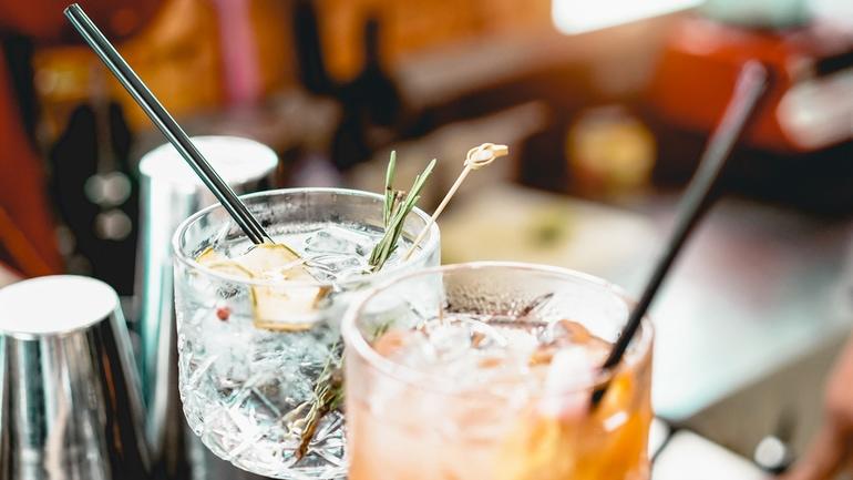 Close up of garnished cocktails in cut crystal glasses