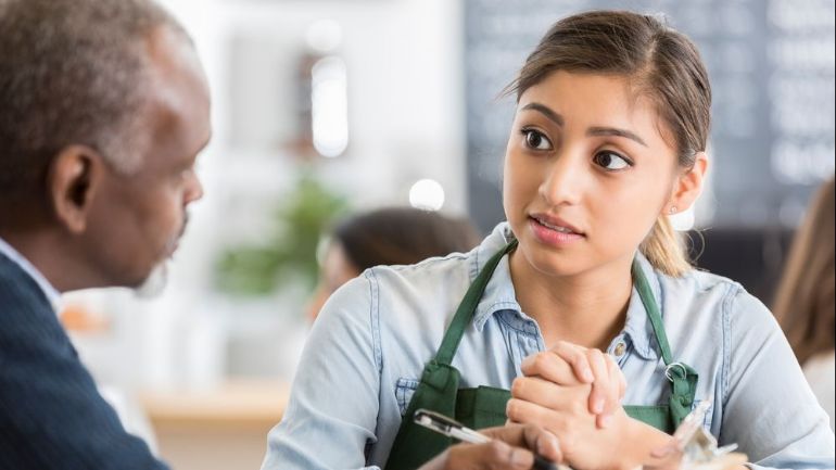 HR manager having a conversation with restaurant employee