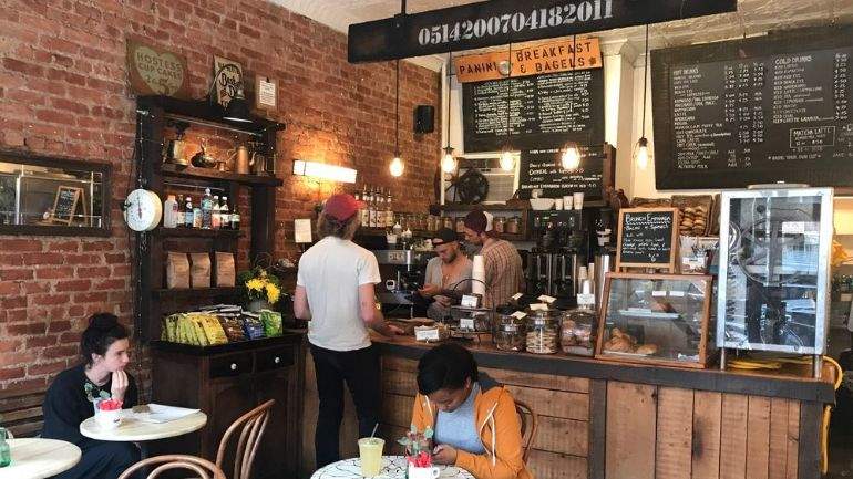 Customer placing an order at a cafe counter