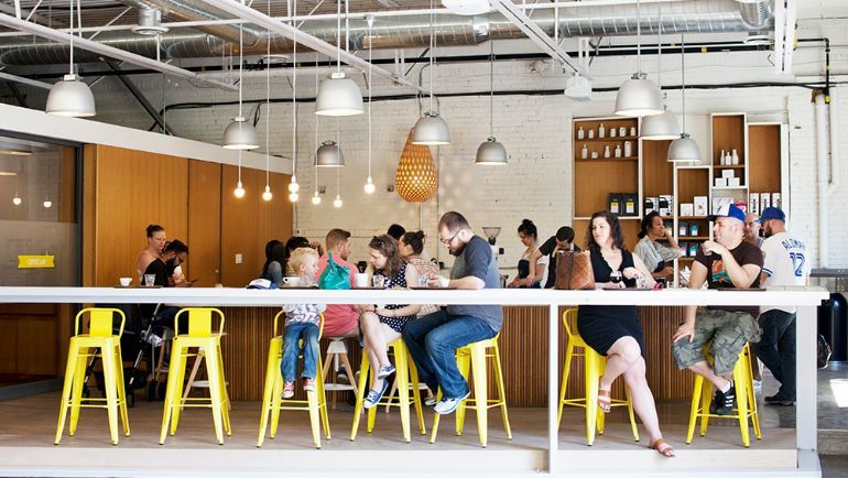 Patrons sitting in a pilot coffee roasters location