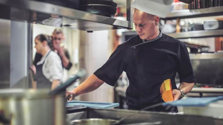 Chef prepping butternut squash