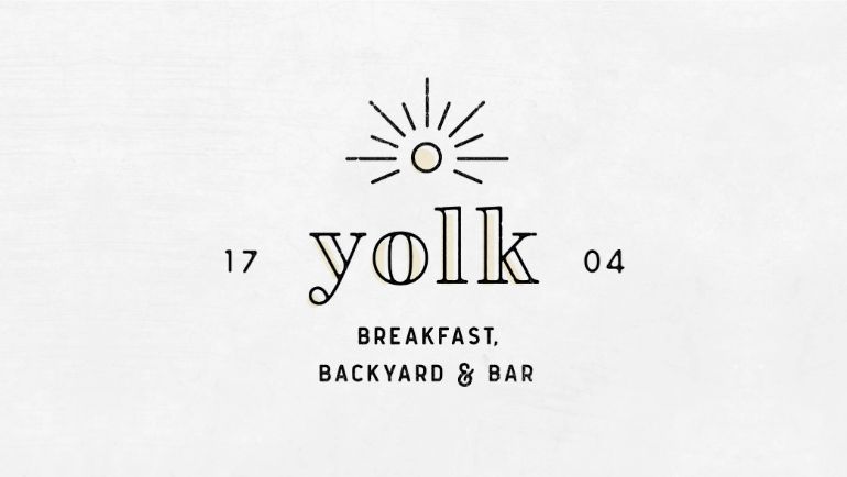 Yolk breakfast backyard and bar logo