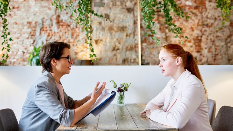 Restaurant manager interviewing an applicant