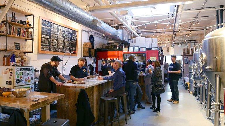 peoples pint brewery bar with visiting patrons
