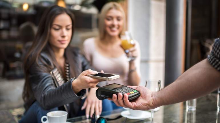 customer paying with smart phone