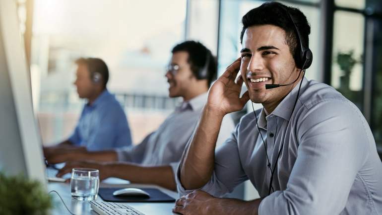 tech support worker in headset smiling