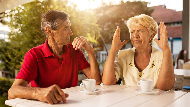 two customers on a coffee shop patio