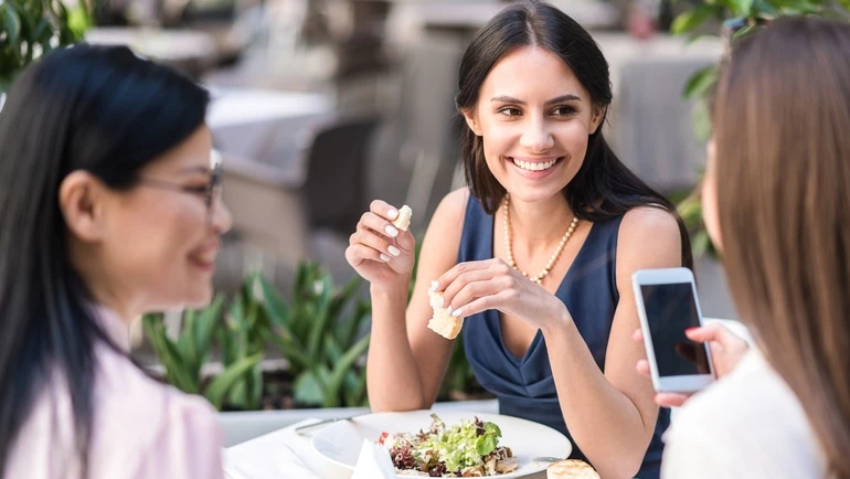 Woman dining with friends