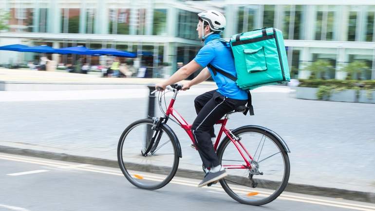 food delivery person on bicycle