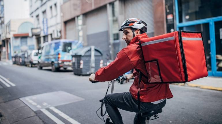 food courier delivering food on bike