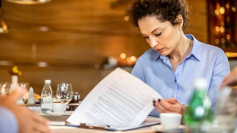 restaurant owner reviewing insurance policy