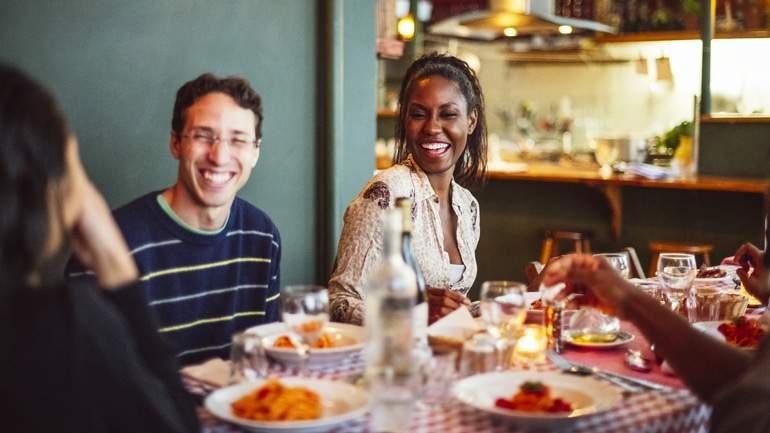 diners smiling during their meal