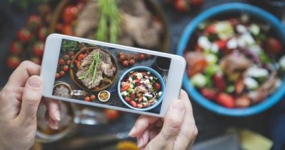 using a smart phone to photograph beautifully plated food