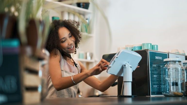 counter staff entering an order on hybrid POS