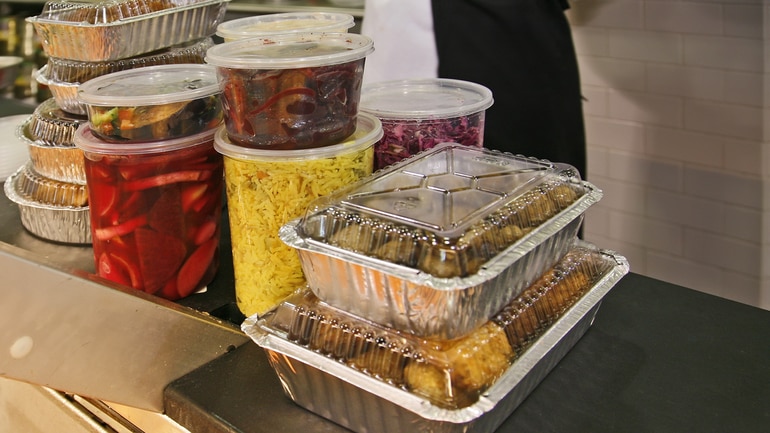 Restaurant food packaged in takeout containers