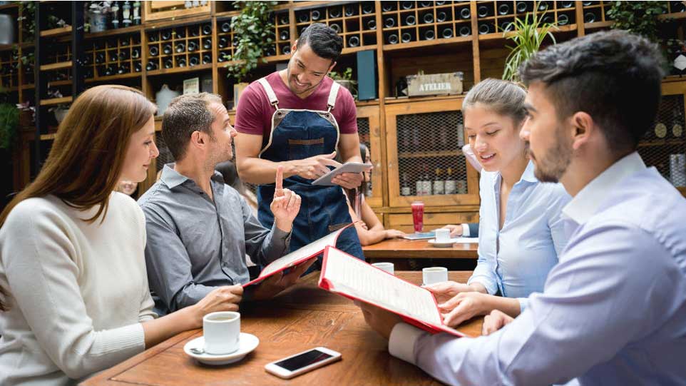 server taking order tableside with iPad EPOS