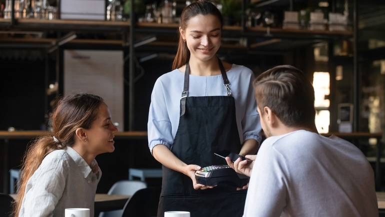 server taking payment tableside