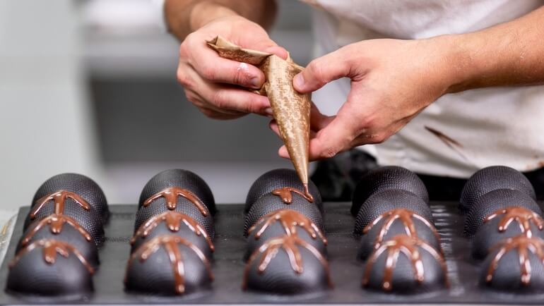 pastry chef decorating confections