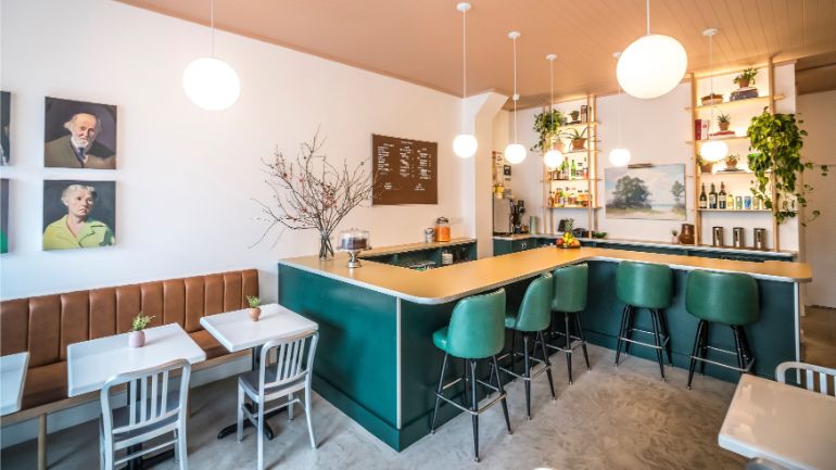 restaurant interior in teal and cream