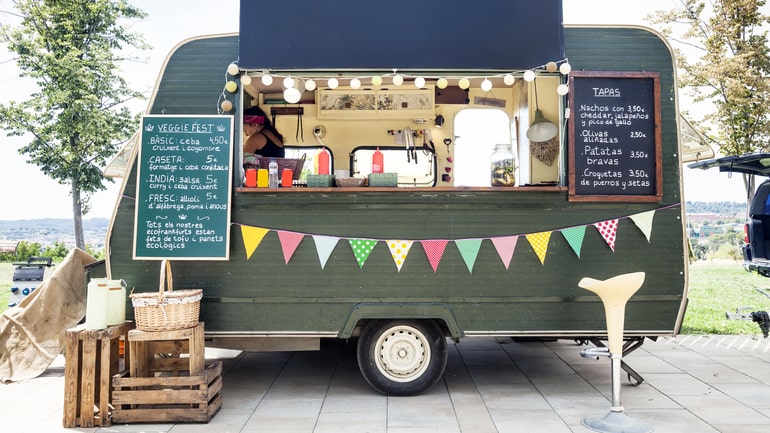 Food truck parked in a park