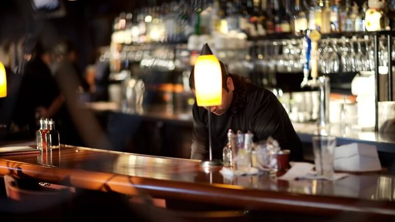 Busy bartender working behind the bar.