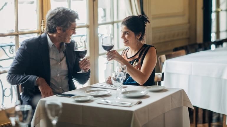 Couple on a date at a fine dining restaurant.