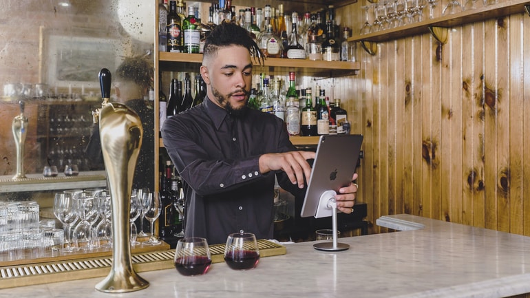 Bartender using a restaurant POS system.