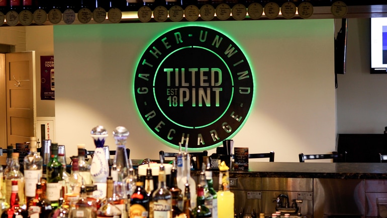 Neon sign for the Tilted Pint restaurant.