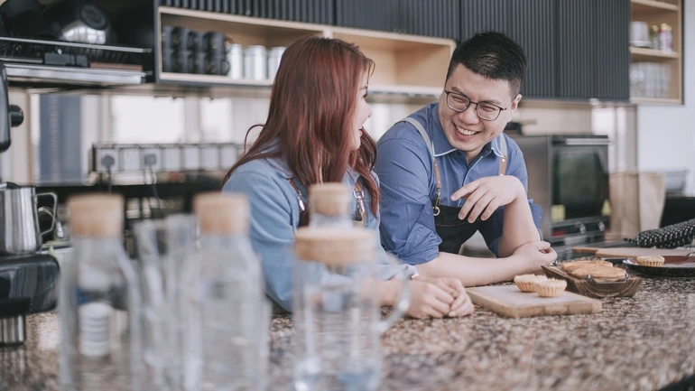 Two employee workers taking a break and chatting.