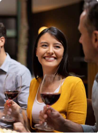 A girl smiling at dinner