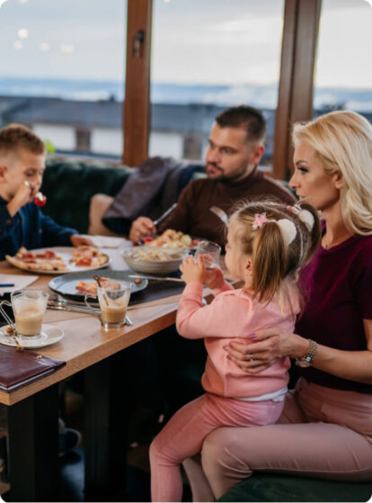 A family eating dinner at a restaurant