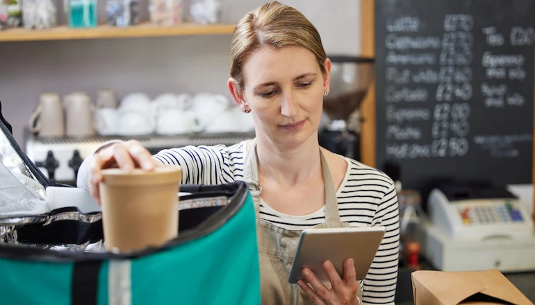 Female restaurant workers with ocean friendly packaging to ensure the management of waste.