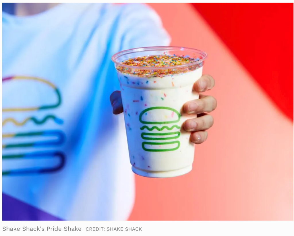 Close-up shot of Shake Shack's Pride Shake, which is topped with rainbow colored sprinkles.