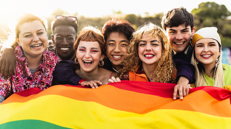 A group of young friends celebrating Pride Month.