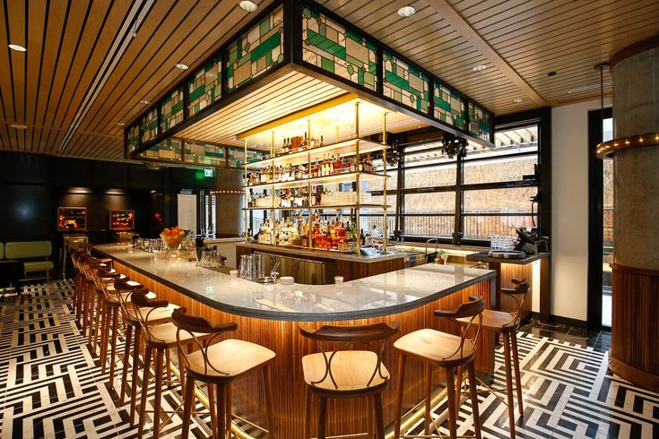 An art deco-stye bar and geometric tile floor in Denver, Colorado.