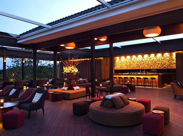 Moody red and brown patio furniture on the patio of the Metis Bali Restaurant.