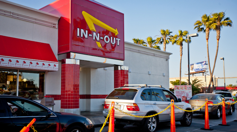 A busy drive-thru outside of an In-n-out Burger restaurant at the Los Angeles Airport.