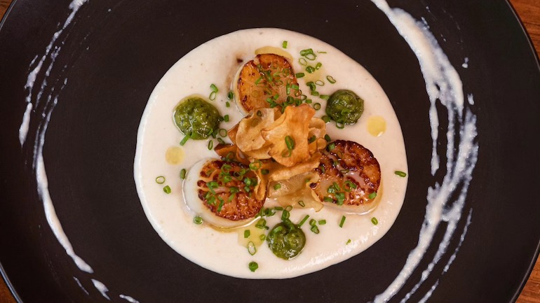 Beautifully plated scallops dish from Tango Nuevo.