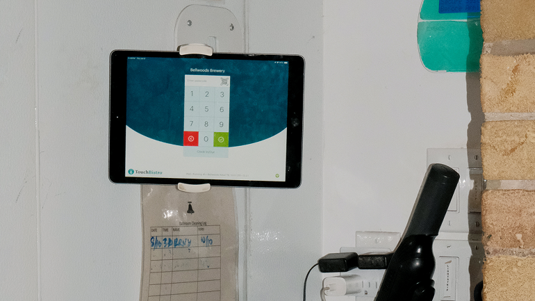 Image of TouchBistro POS system attached to a wall.